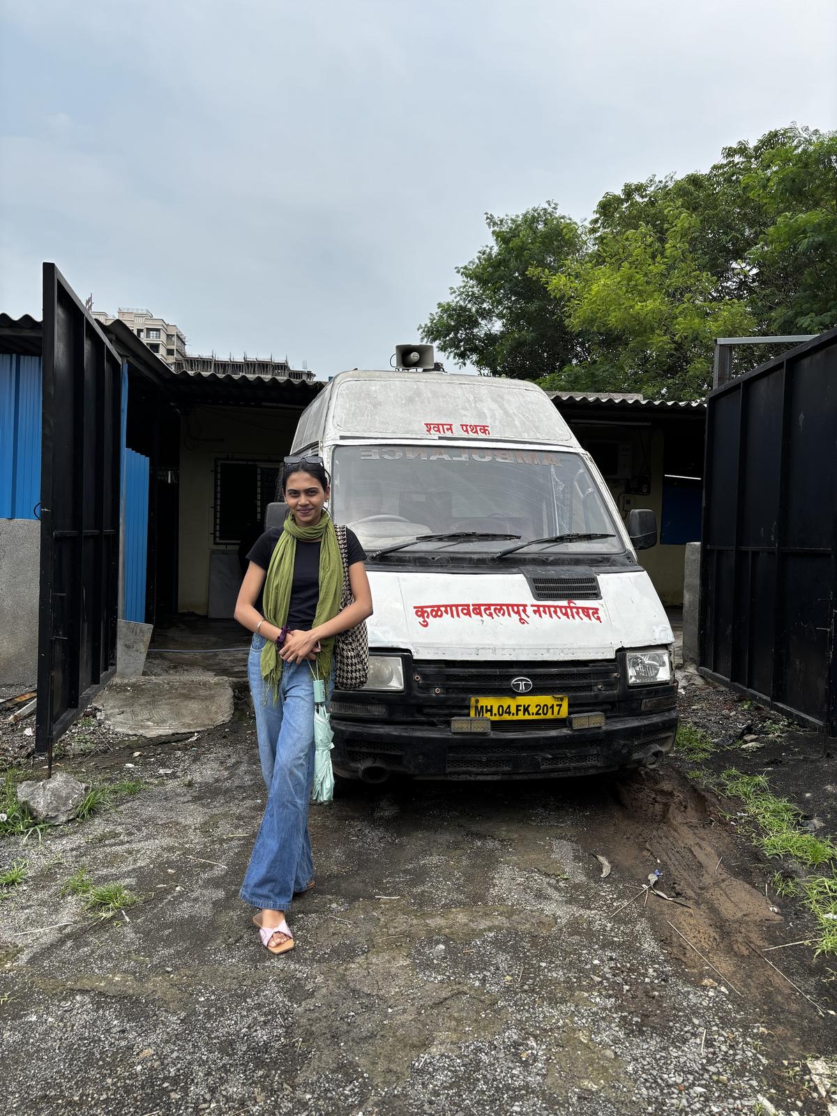 Volunteer beside an animal rescue van